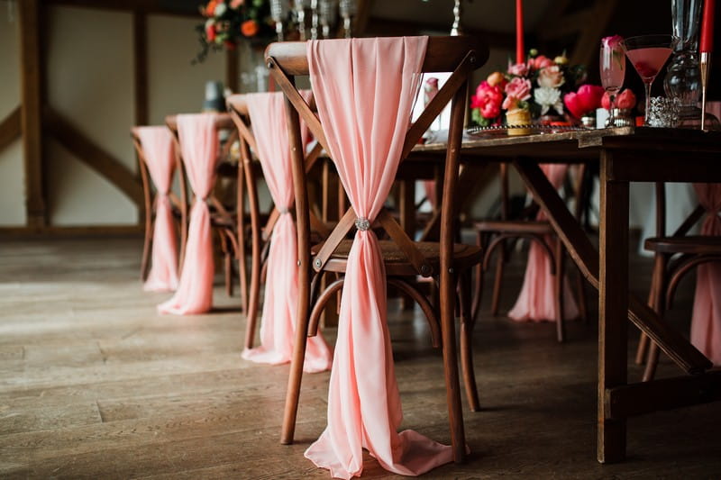Coral sashes on chairs