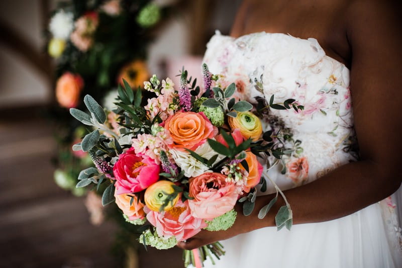 Colourful bridal bouquet with coral and pink flowers