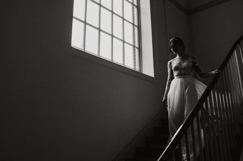 Bride walking down stairs at Fulham Palace