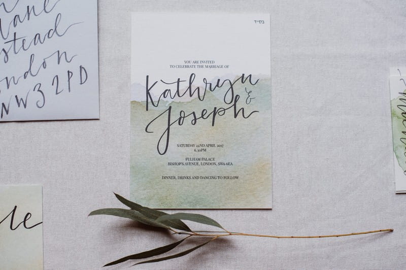 Wedding invitation with green watercolour design