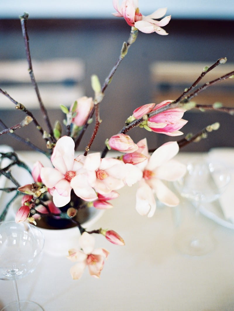 Wedding table display of pink and white magnolia flowers