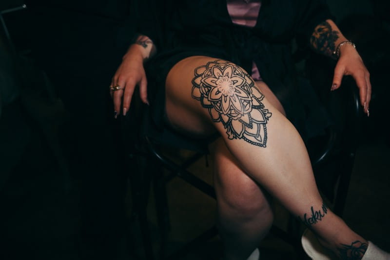Tattoo on bride's leg