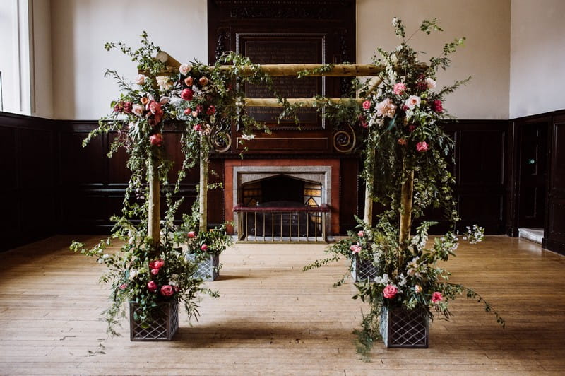 Chuppah styled with flowers and foliage