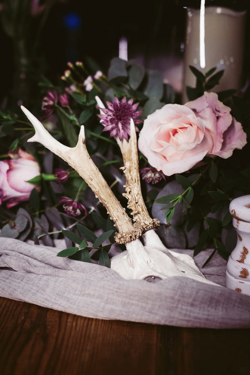 Skull by wedding table flowers