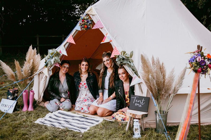Girls sitting in tipi at hen party