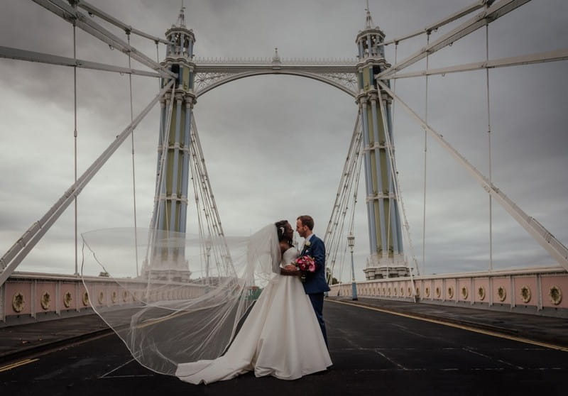 Bride and groom on Albert Bridge in London - Picture by Benjamin Wetherall Photography