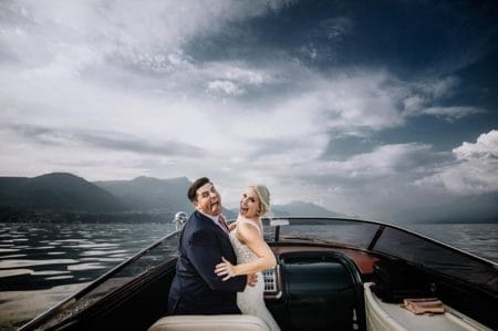 Bride and groom on boat pulling funny faces - Picture by Nicola Tonolini