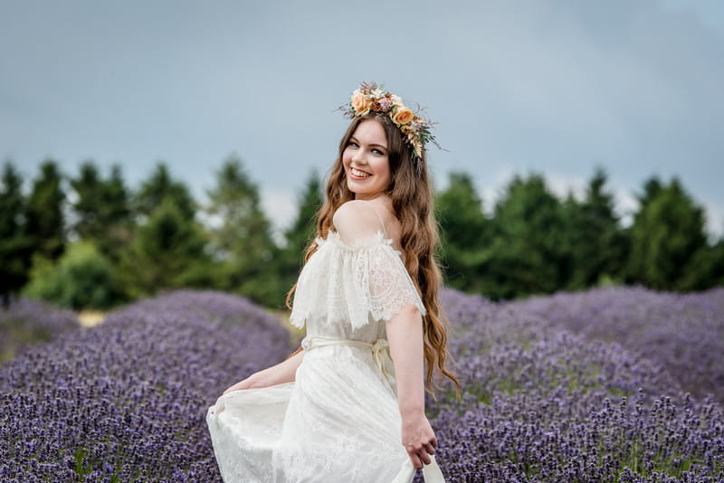 Bride twirling in field of lavender