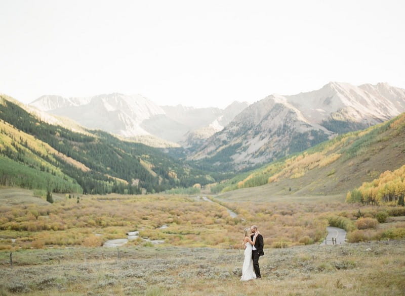 Bride and groom with mountaisn in background - Picture by Matthew Moore Photography