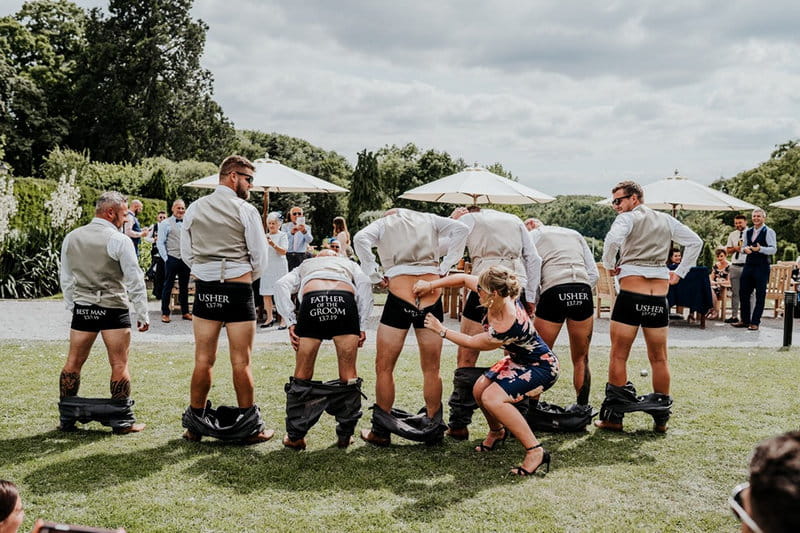 Groomsmen with trousers pulled down - Picture by Ryan Goold Photography