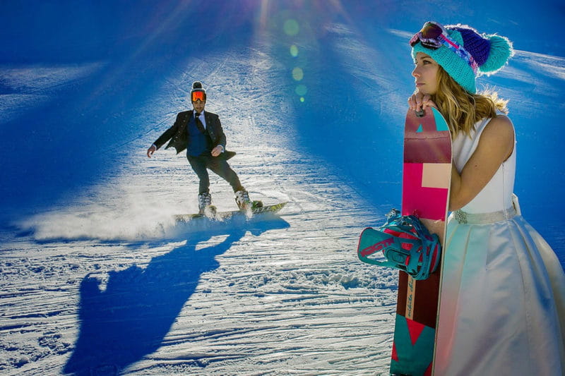 Bride and groom snowboarding - Picture by Lovelyphoto