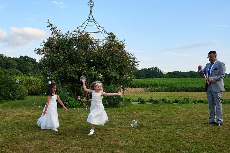 Children playing outside and Southdowns Manor wedding