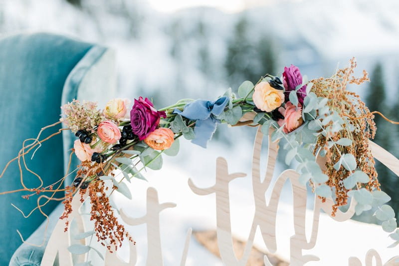 Flowers on top of hoop sign