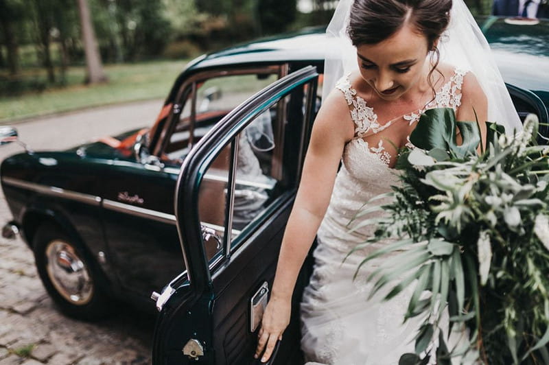 Bride getting out of wedding car - Picture by Kev Elkins Photography