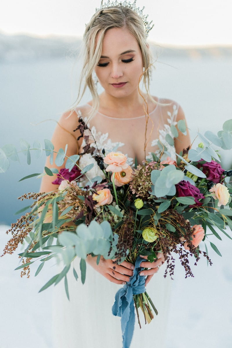 Bride holding winter bouquet