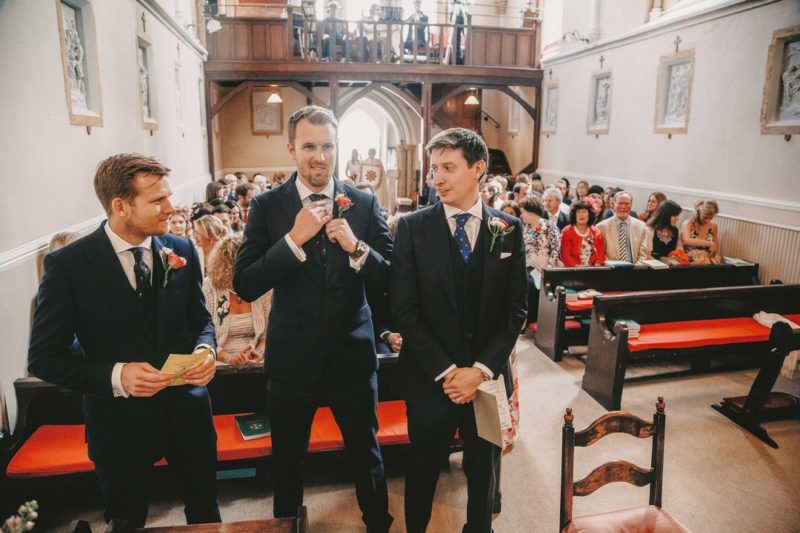 Groom and groomsmen at front of church