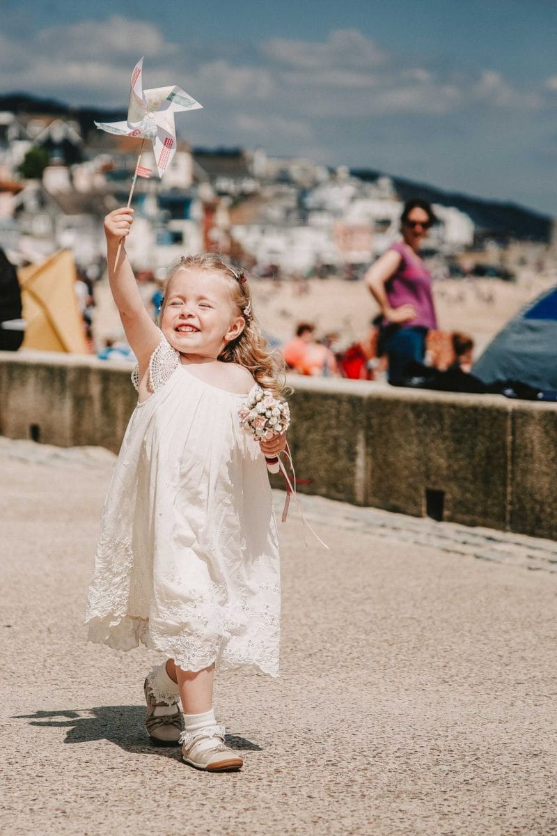 Flower girl holding pinwheel