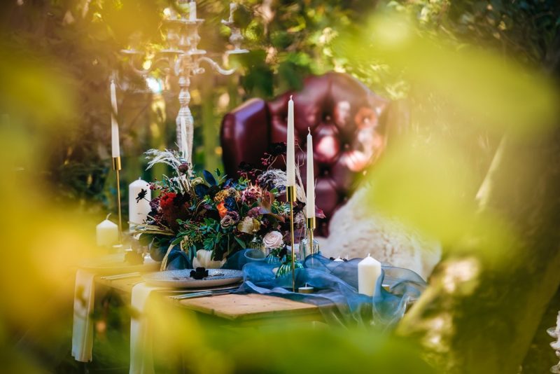 Colourful wedding table flowers and candles