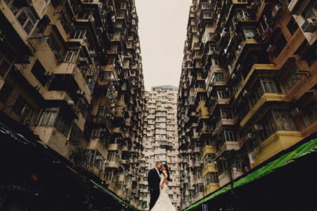 Bride and groom surrounded by tower blocks - Picture by Ash Davenport of MIKI Studios