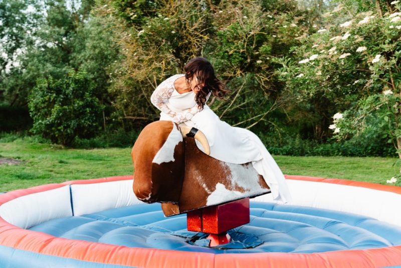 Bride on bucking bronco ride - Picture by Fiona Kelly Photography