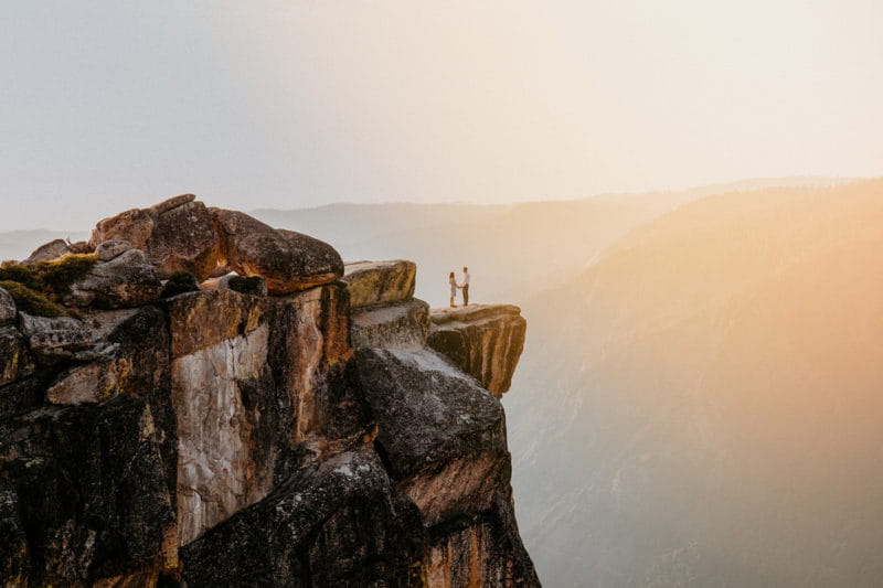 Couple standing on edge of cliff - Picture by Lilly Sells Photography