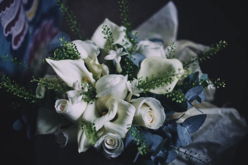 White roses and lilies in wedding bouquet