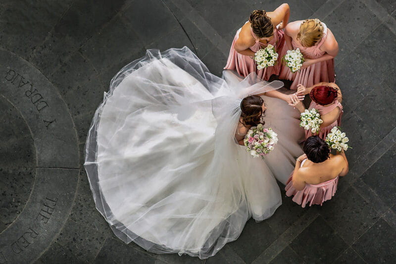 Aerial shot of bride showing bridesmaids her wedding ring - Picture by Dan Morris Photography