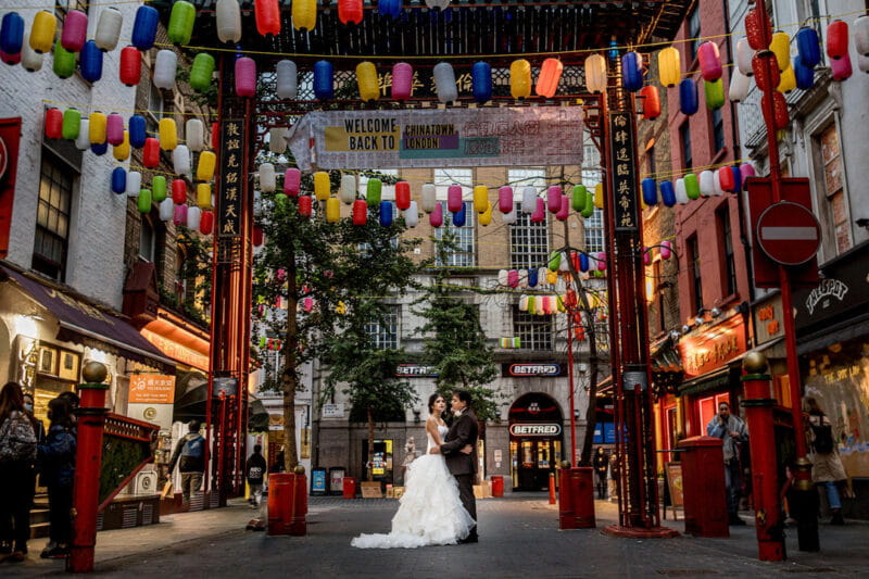 Bride and groom under lanterns in Chinatown, London - Picture by Rafe Abrook Photography