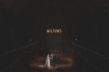 Wedding ceremony on stage at Wilton's Music Hall - Picture by Rik Pennington Photography