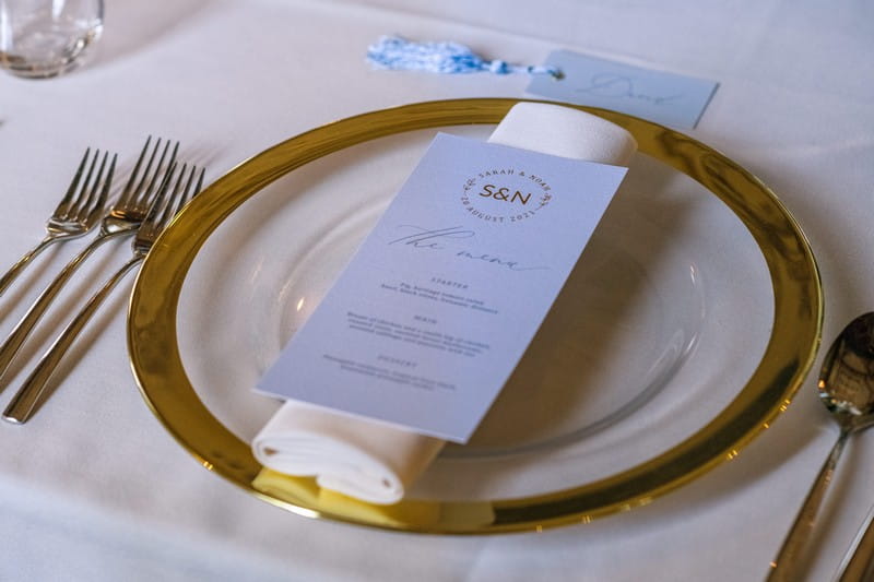 Wedding place setting with gold rimmed plate