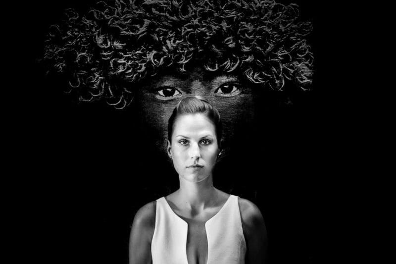 Bride standing with face behind her head - Picture by Pollok Pictures