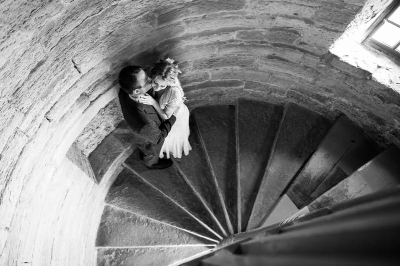 Couple on spiral stairwell