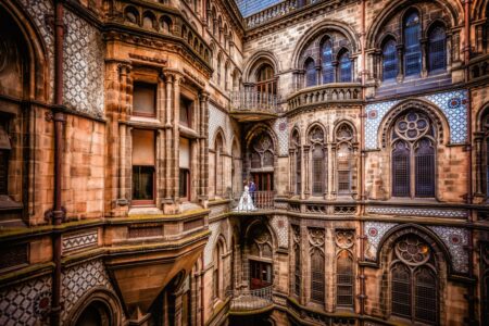 Bride and groom on balcony of Manchester Town Hall - Picture by Paul Baybut Photography