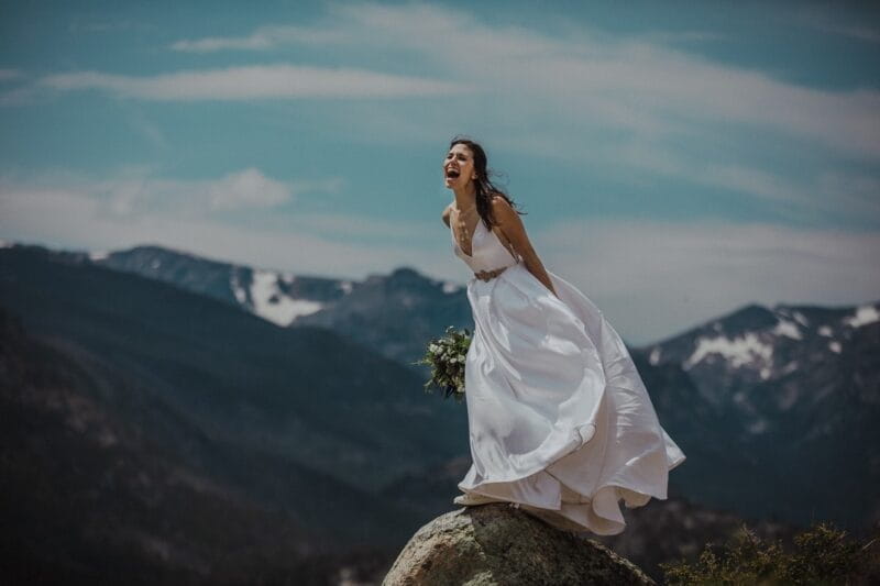 Bride shouting from the top of a mountain - Picture by MSW Photos