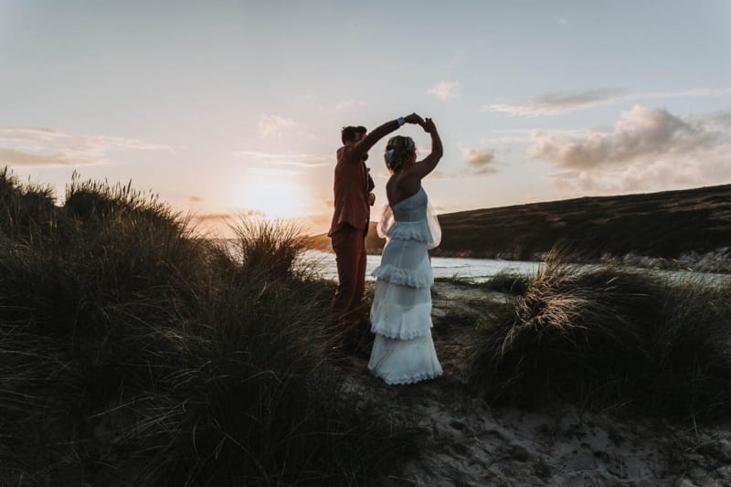 Bride and groom dancing outside as the sun sets - Picture by Mollie McAusland Photography